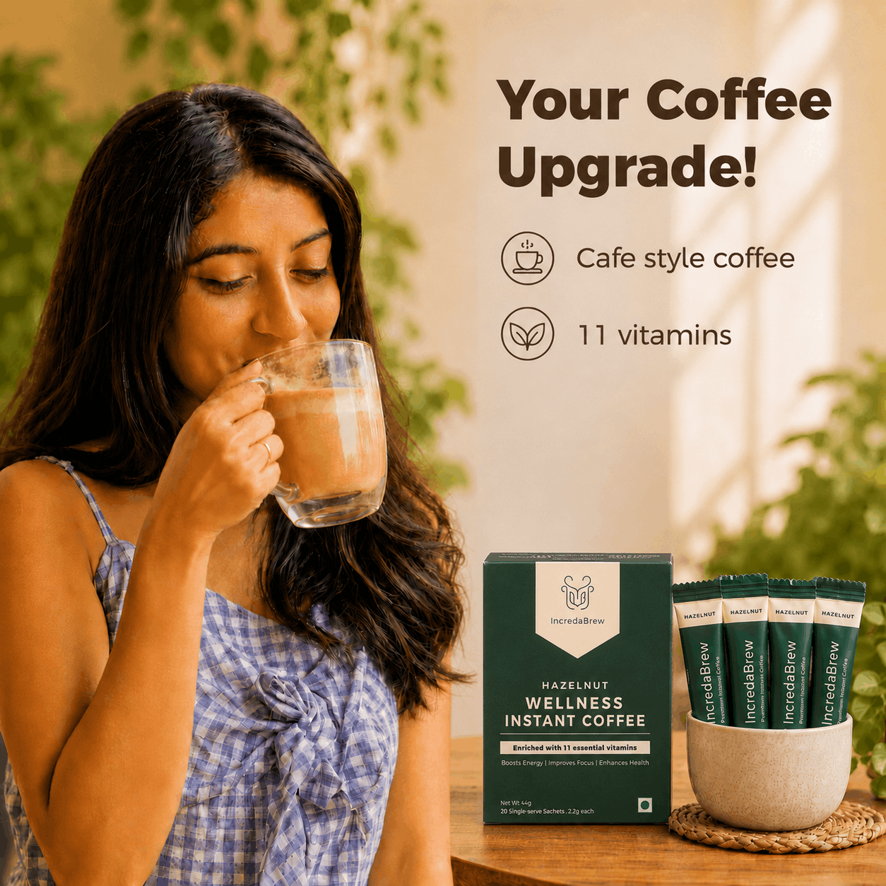Woman enjoying IncredaBrew Hazelnut Flavour Wellness instant coffee beside the box and sachets, highlighting café-style coffee with 11 vitamins.