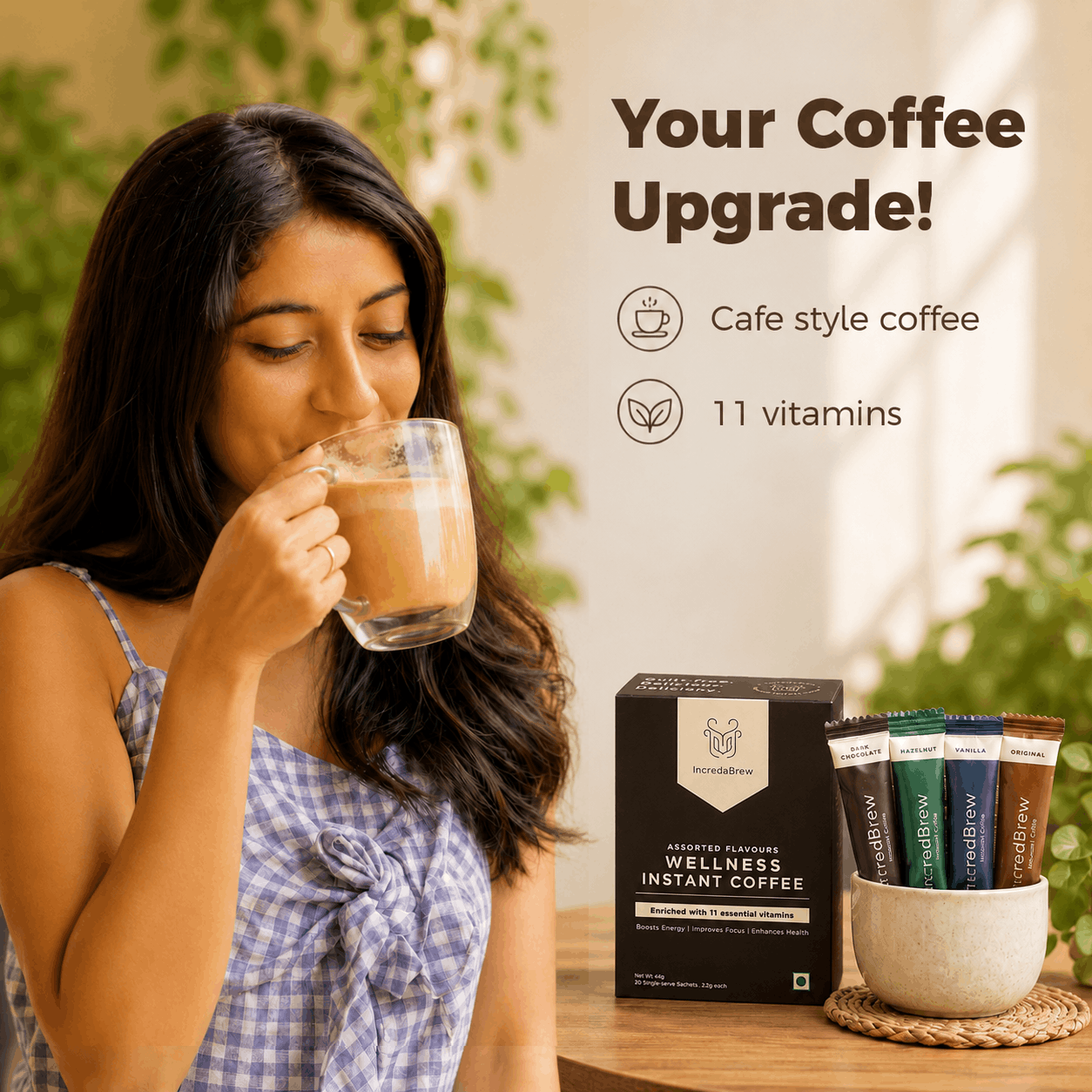 Woman enjoying IncredaBrew Assorted Flavours Wellness instant coffee beside the box and sachets, highlighting café-style coffee with 11 vitamins.