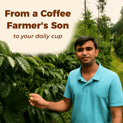 IncredaBrew founder standing among coffee plants and holding a branch of coffee cherries on his Chikmagalur coffee farm