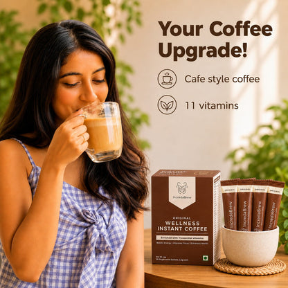 Woman enjoying IncredaBrew Original Flavour Wellness instant coffee beside the box and sachets, highlighting café-style coffee with 11 vitamins.