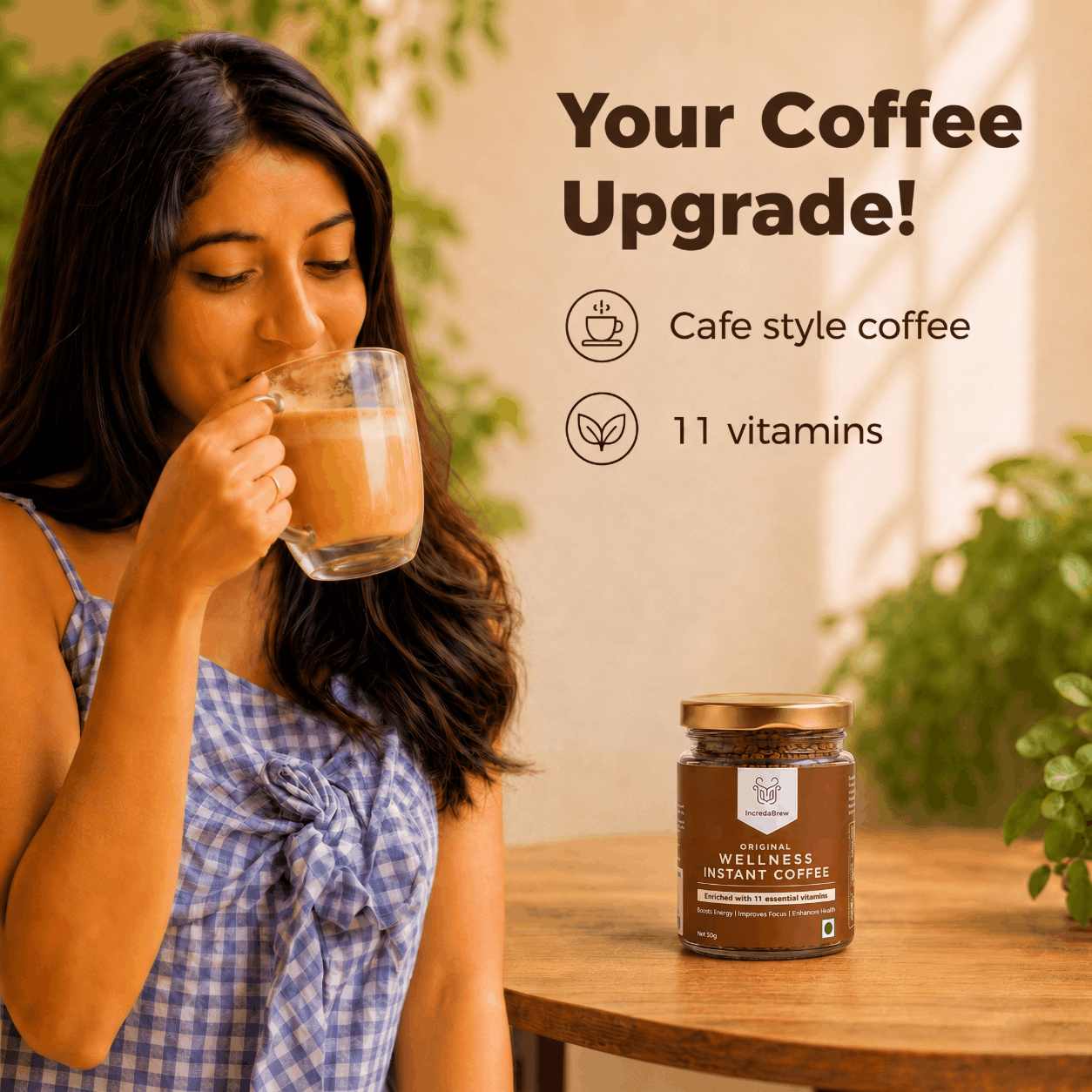 Woman enjoying IncredaBrew Original Flavour Wellness instant coffee beside the box and sachets, highlighting café-style coffee with 11 vitamins.