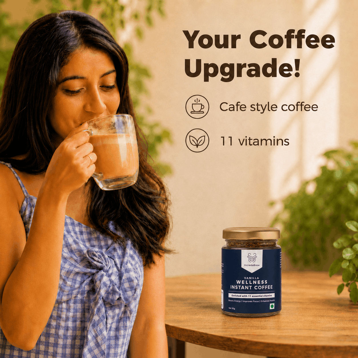 Woman enjoying IncredaBrew Vanilla Flavour Wellness instant coffee beside the box and sachets, highlighting café-style coffee with 11 vitamins.