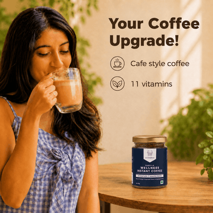 Woman enjoying IncredaBrew Vanilla Flavour Wellness instant coffee beside the box and sachets, highlighting café-style coffee with 11 vitamins.